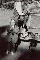 Judy Ann with tractor and Max the dog